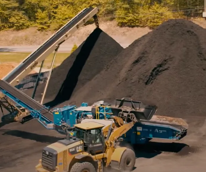 Black mulch processing at Beaulieu Logging yard, Lyman Maine